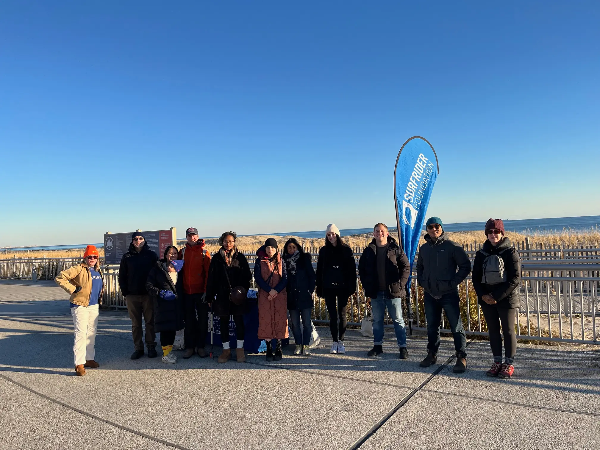 surfrider nyc supporters standing on the boardwalk