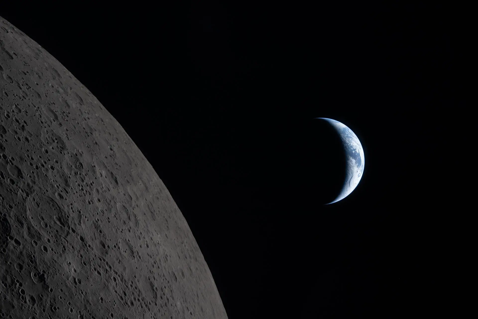 NASA image of crescent earth with moon